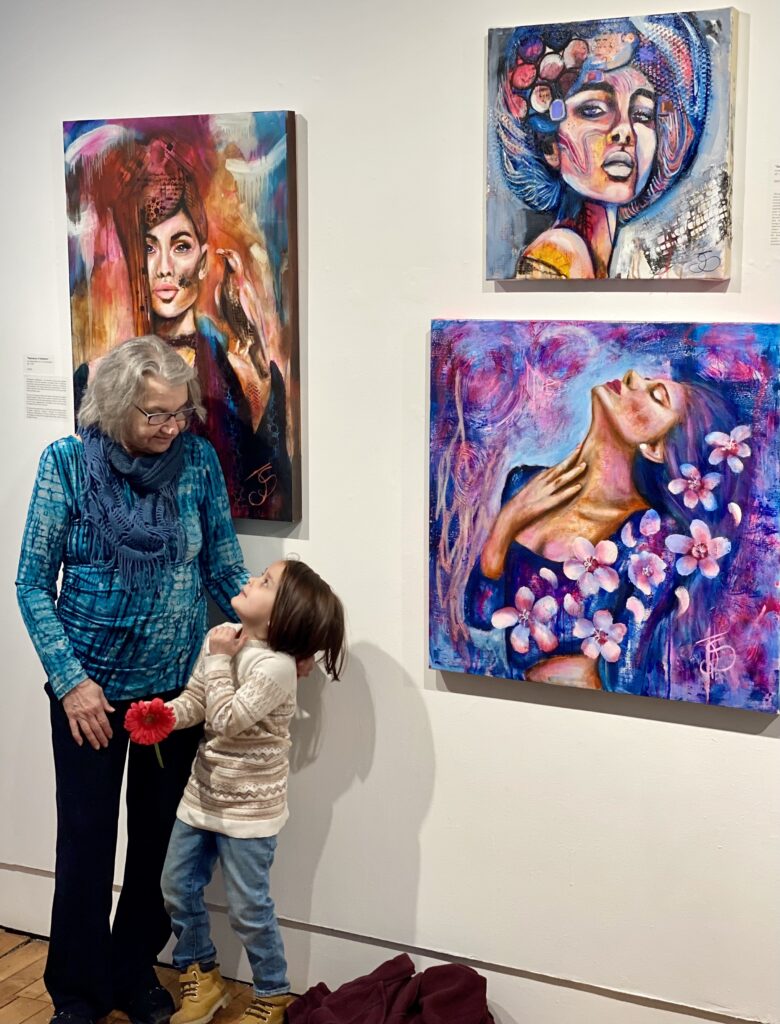 Canadian sovereignty and community resilience reflected in an elder and child sharing an intergenerational art experience.